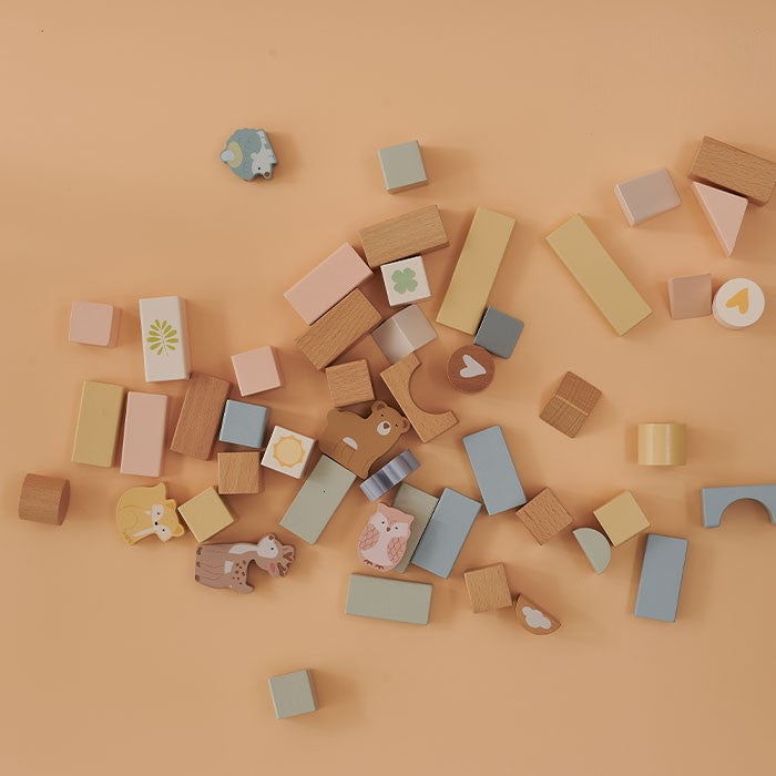 Colorful wooden blocks on a beige background