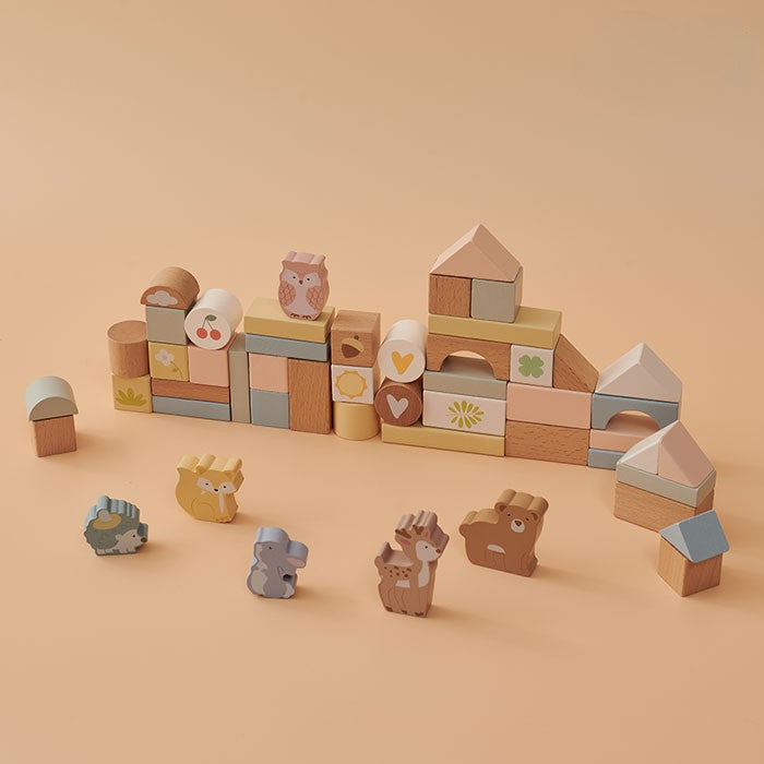 Fiesta 50-piece wooden animal block set displayed with six woodland animal figures and assorted shape blocks in soft muted tones