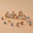 Fiesta 50-piece wooden animal block set displayed with six woodland animal figures and assorted shape blocks in soft muted tones