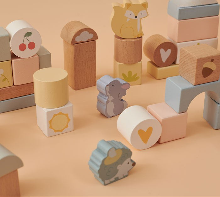 Wooden blocks with animal designs on a beige background