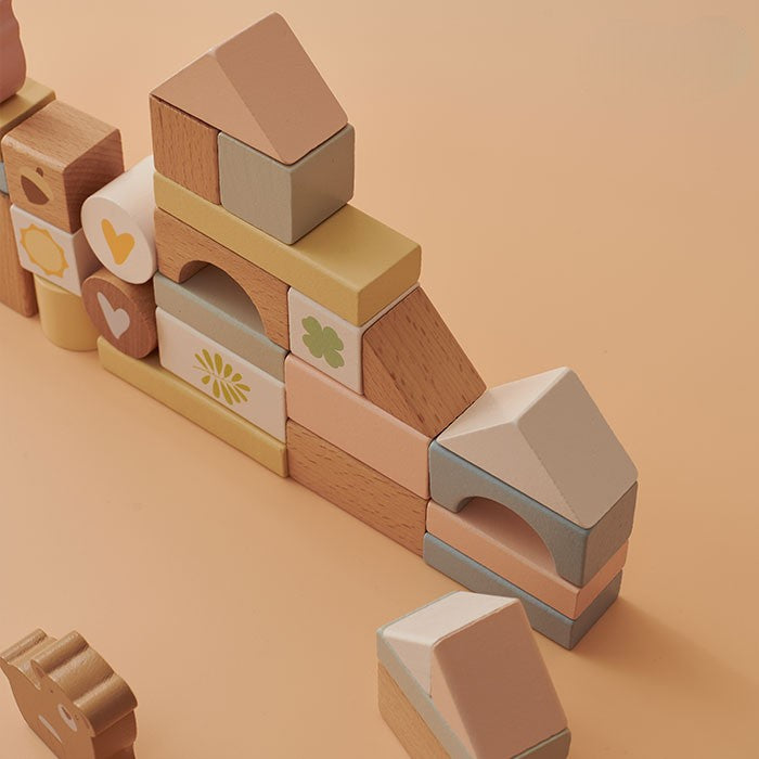 Wooden building blocks with geometric shapes on a beige background