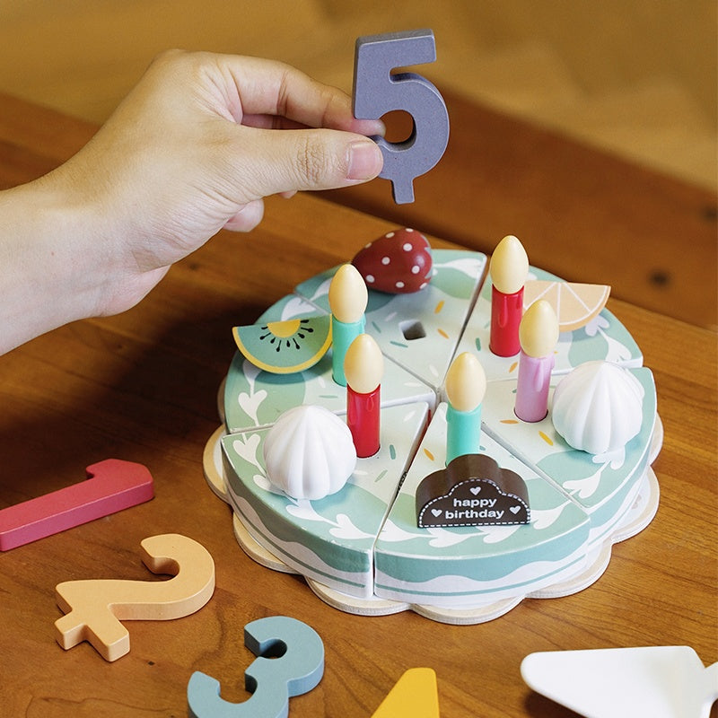 Complete wooden birthday cake Montessori playset showing all decorative elements and accessories