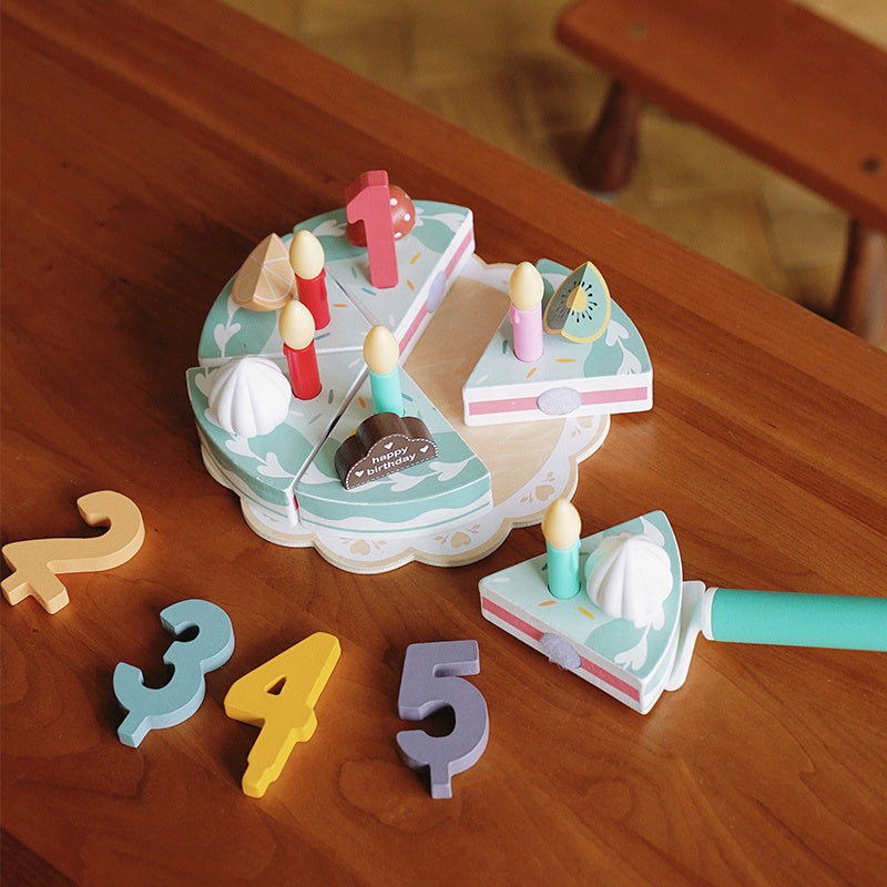 Complete wooden birthday cake Montessori playset showing all decorative elements and accessories