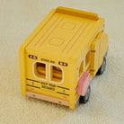 Four-step play sequence showing bus driving, roof opening, chalkboard flipping, and classroom pretend play scene