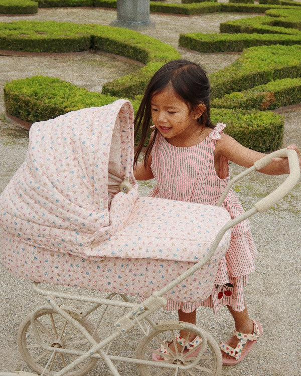 Bloomie blush baby doll pram with under-basket storage and authentic vintage garden styling