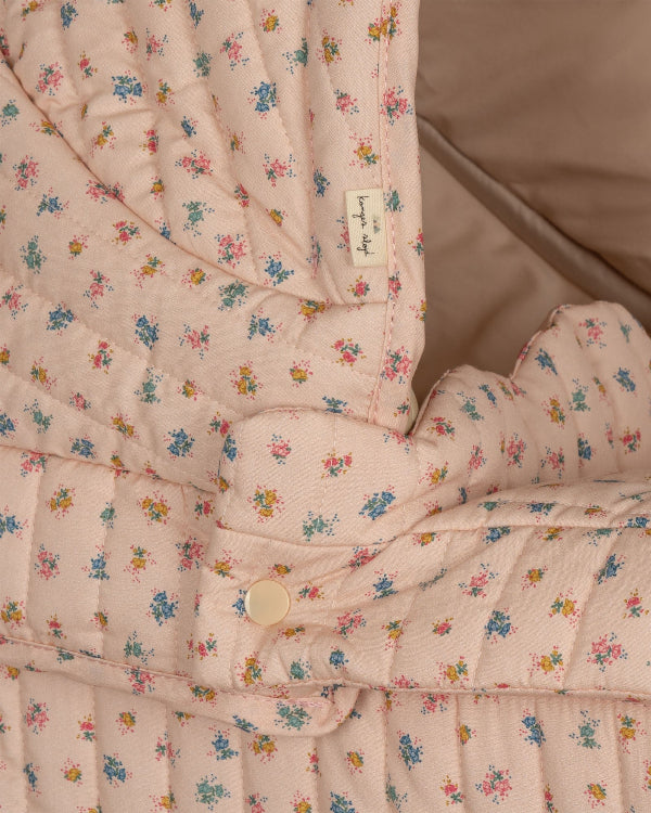 Premium blush-toned doll stroller featuring gentle pink florals with cotton mattress and metal frame