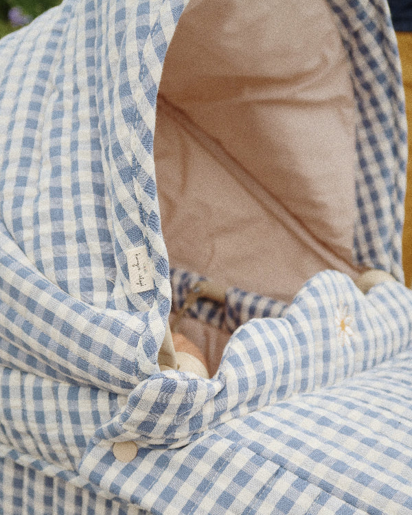 Vintage-style maritime pram with elegant scallop edges and soft-grip handles perfect for coastal doll adventures