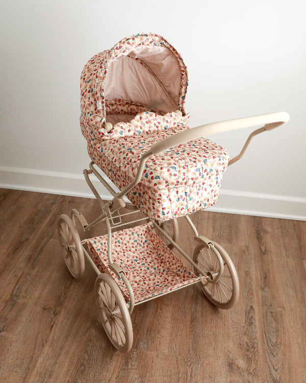Vintage-style wildflower pram with charming scallop edges and soft-grip handles perfect for meadow doll adventures
