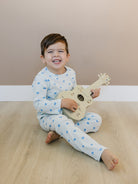 Toddler in blush pink heart print comfort wear showing stretchy movement and fit