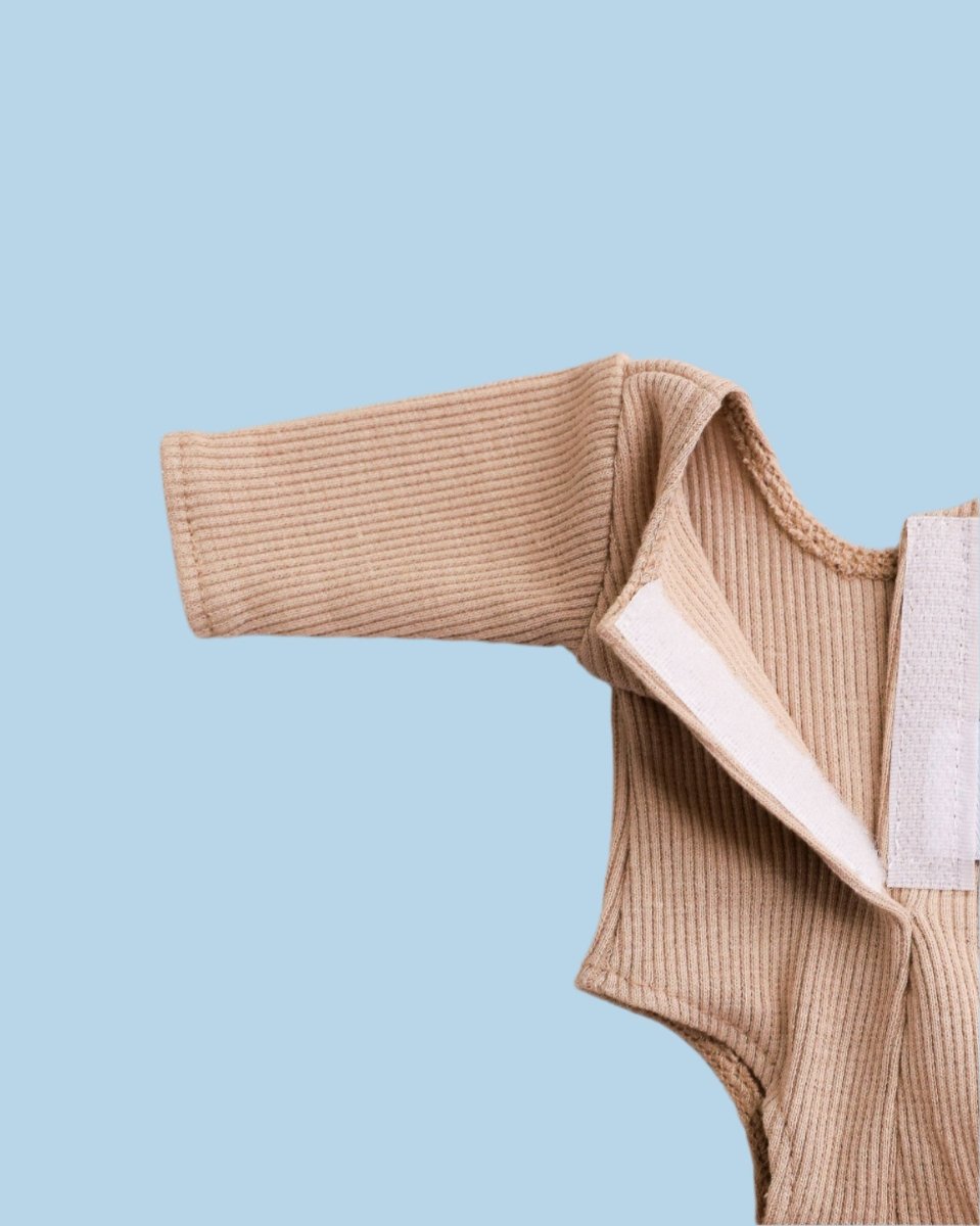 Baby doll clothing featuring handmade elements