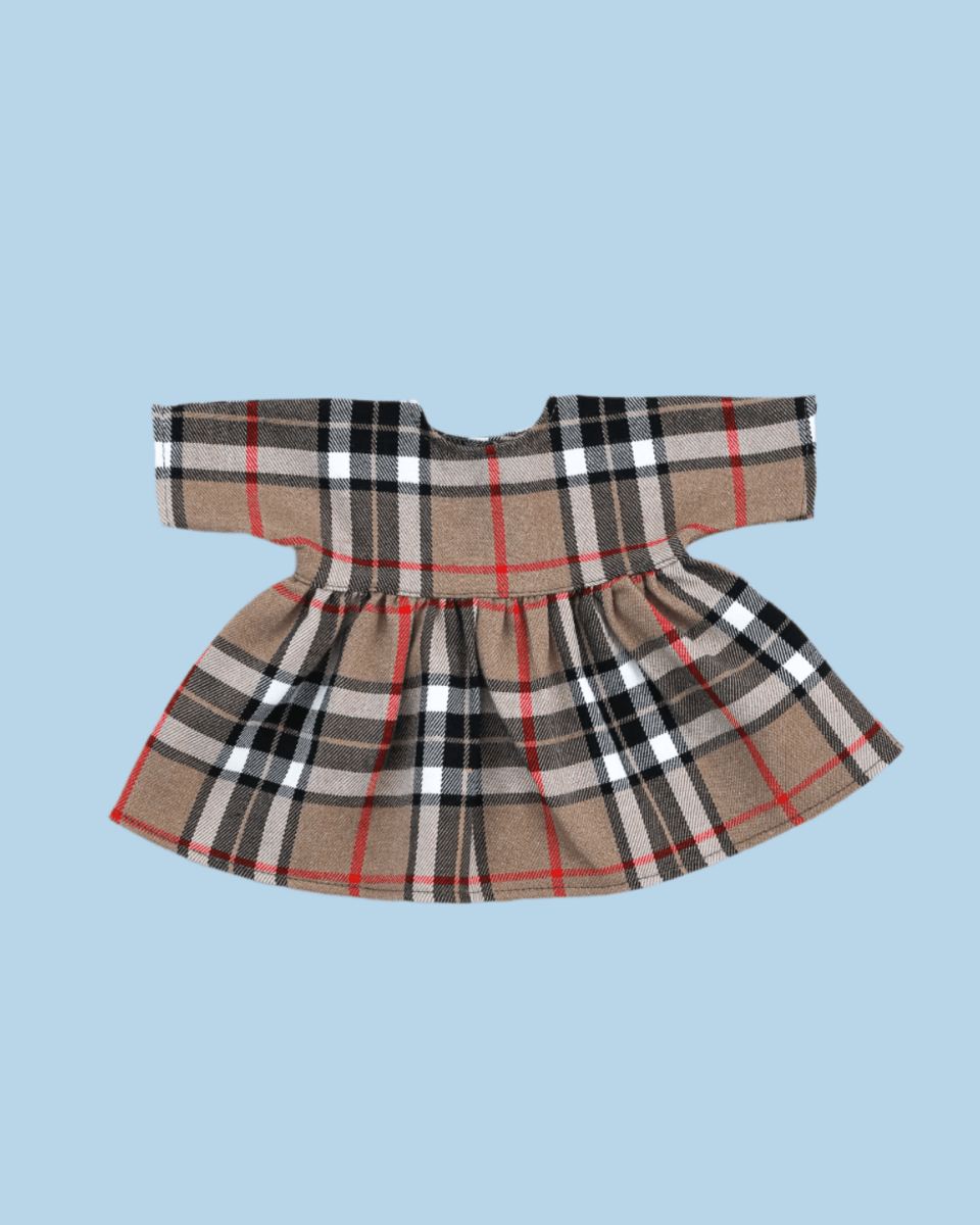 Holiday baby doll clothes with traditional motifs