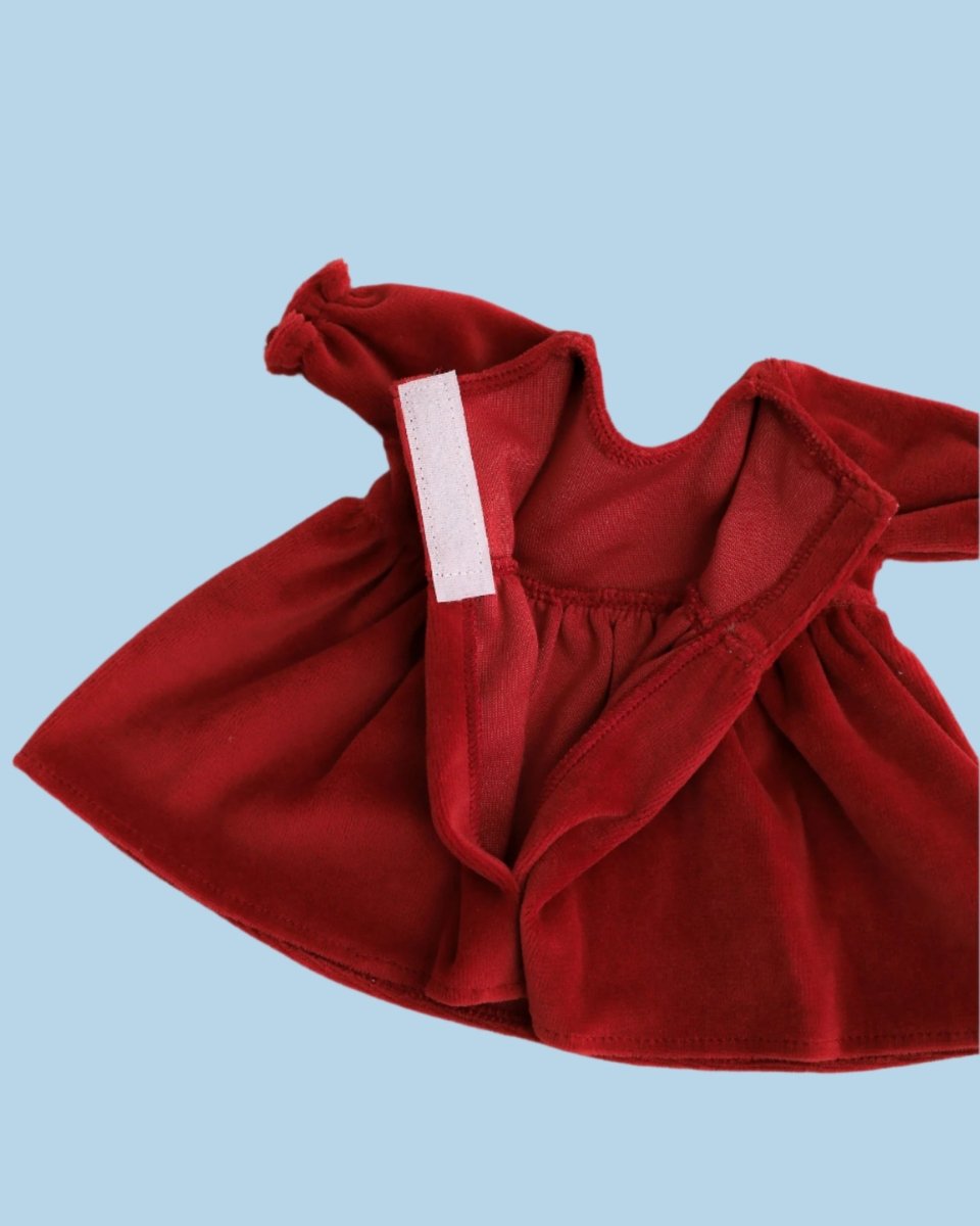 Doll outfit with unique fabric-covered buttons