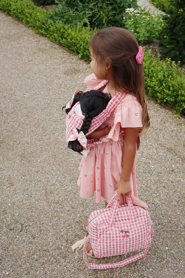 Sweet gingham baby doll carrier with adjustable straps perfect for hands-free nurturing play