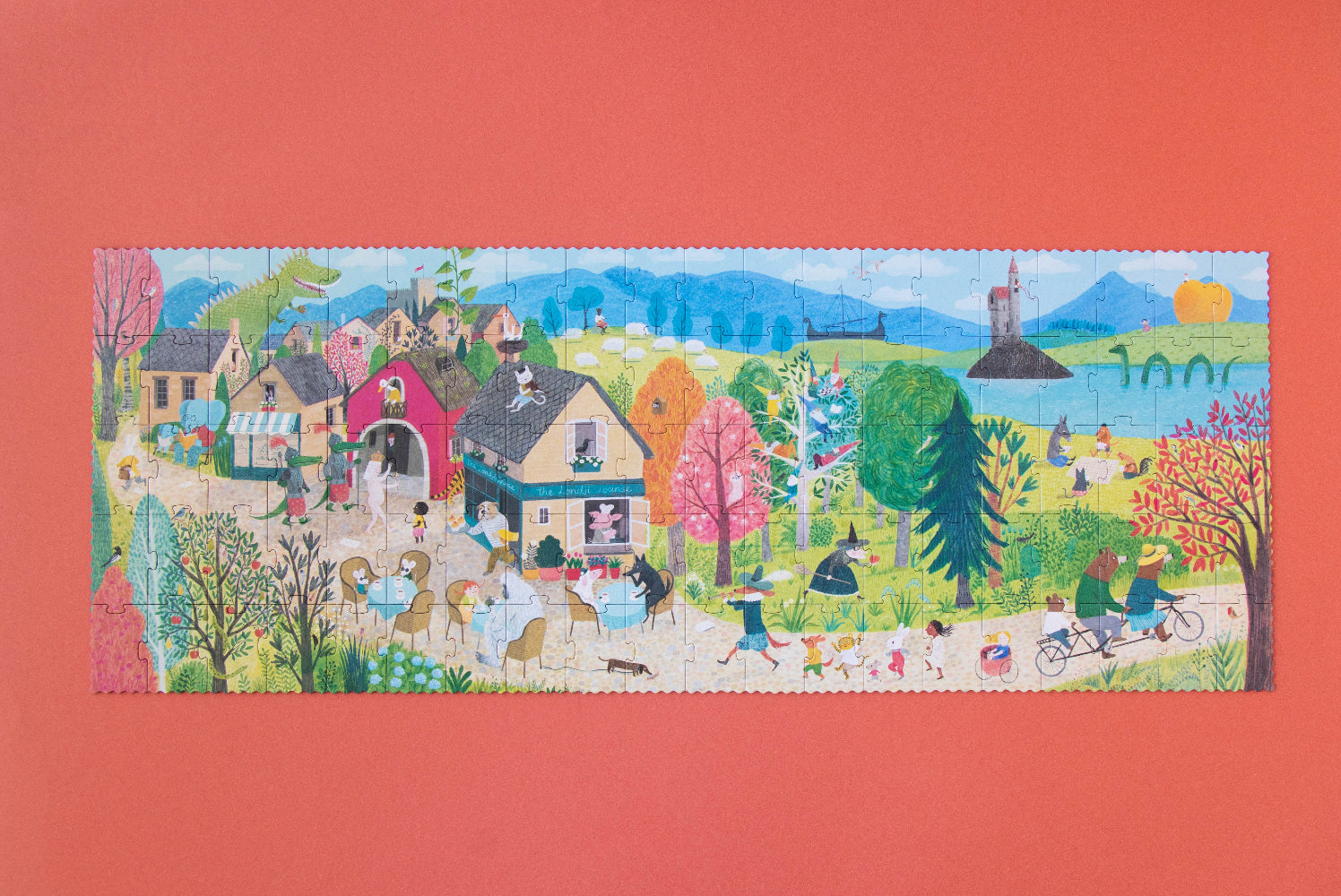 Colorful puzzle with a scenic village design on a red background