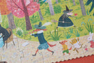 Children's puzzle with a witch and animal characters in a forest setting