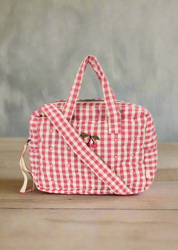 Pink gingham baby doll diaper bag with dual handles and shoulder strap in bubblegum check pattern
