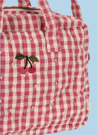 Premium cotton gingham diaper bag with multiple carrying options ideal for little caregivers