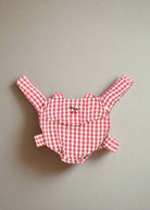 Bubblegum check doll carrier with pink gingham pattern and comfortable scrunch straps