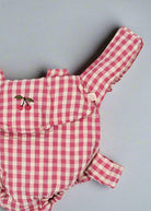 OEKO-TEX cotton doll carrier featuring classic pink and white checkered design with cherry embroidery