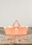 Playroom Collective Konges Sloejd quilted coral doll bassinet with white dots and scalloped cream lining