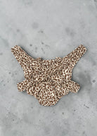 Playroom Collective Konges Sloejd doll carrier in cream and brown leopard print with elastic straps and cherry detail