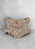 Playroom Collective Konges Sloejd leopard print doll carrier in cream and brown cotton with embroidered cherry detail.