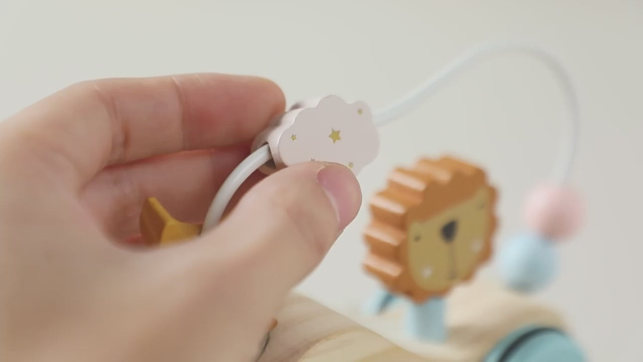 Close-up of wooden lion pull toy showing detailed craftsmanship and non-toxic pastel finishes