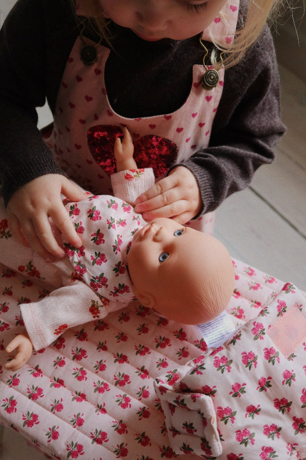 Rosie Rose nursery set styled with matching collection pieces in vintage-inspired doll care setting