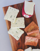 Danish-made pretend play cheese collection with brie, herb cheese, and assorted artisan crackers
