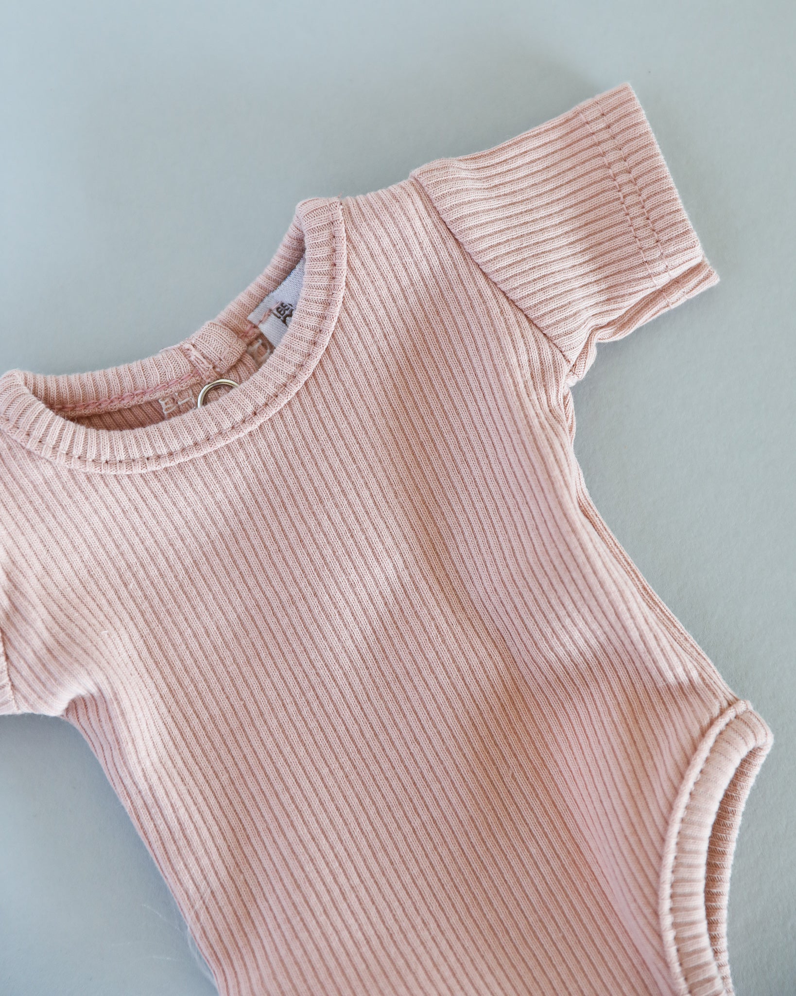 Minikane Doll Clothes | Short Sleeved Baby Doll Bodysuit (Soft Pink)