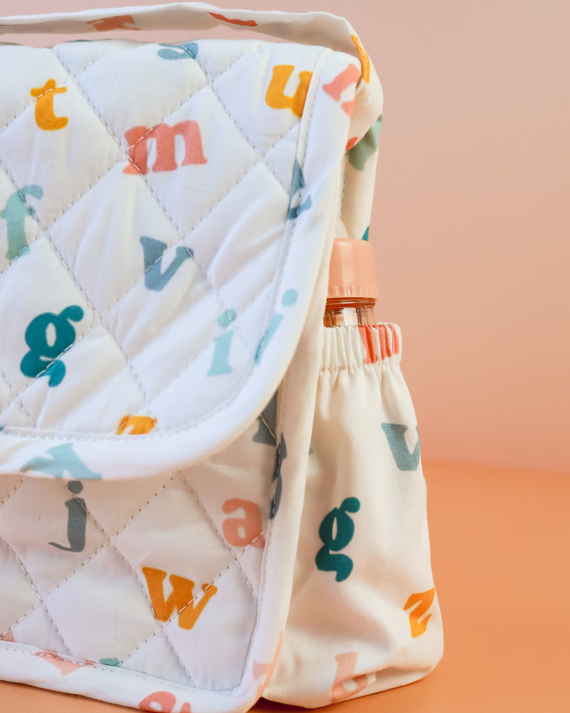 Tiny Harlow | Convertible Doll Diaper Bag Play Set - Alphabet Soup