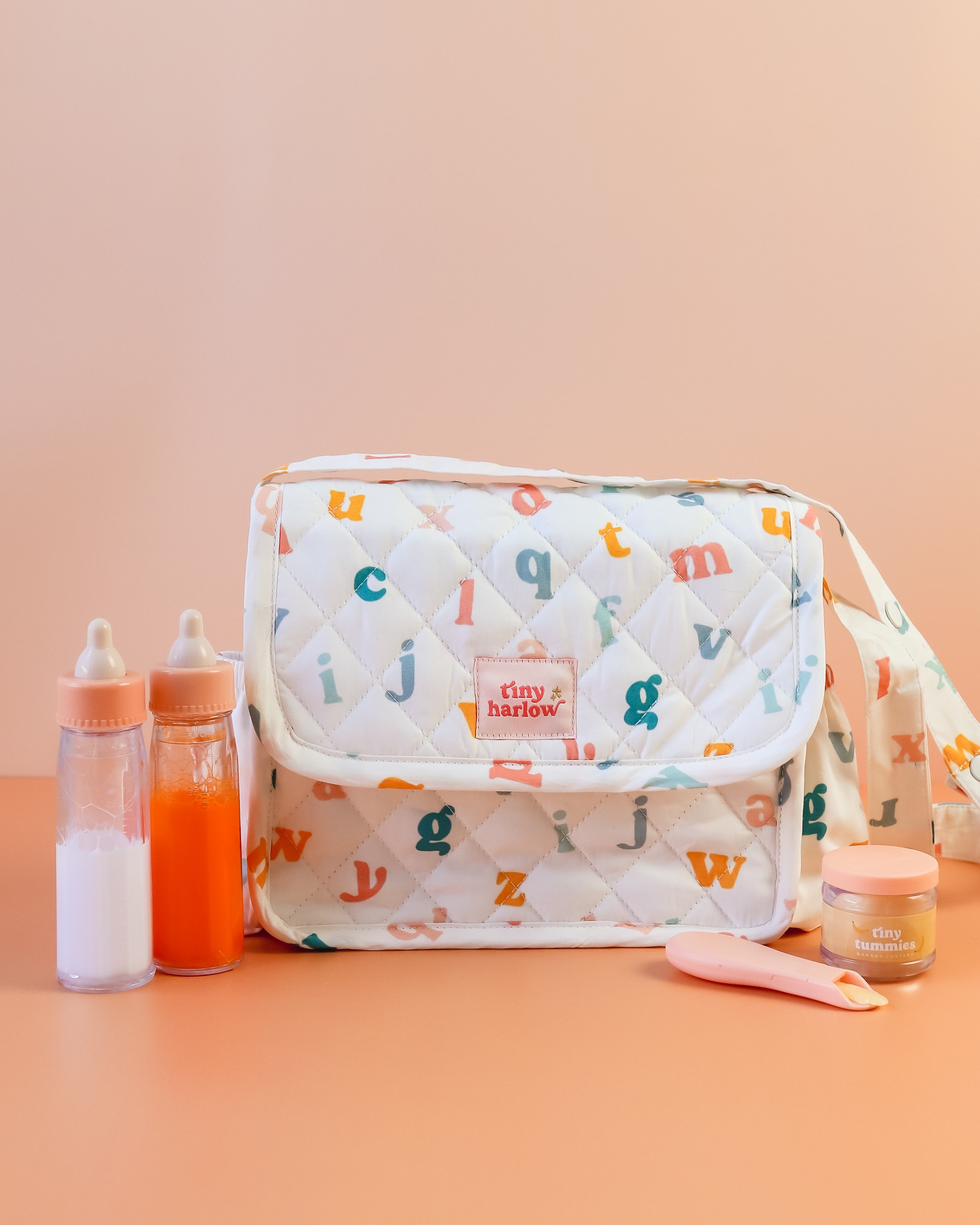 Tiny Harlow | Convertible Doll Diaper Bag Play Set - Alphabet Soup