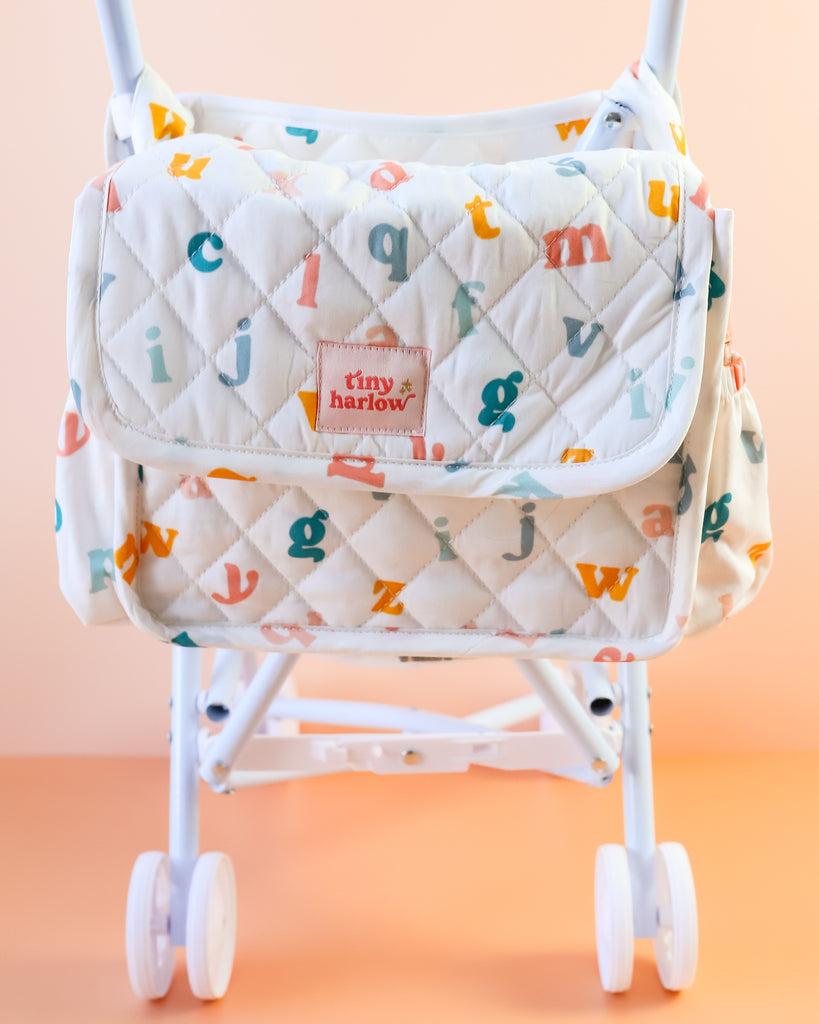 Tiny Harlow | Convertible Doll Diaper Bag Play Set - Alphabet Soup